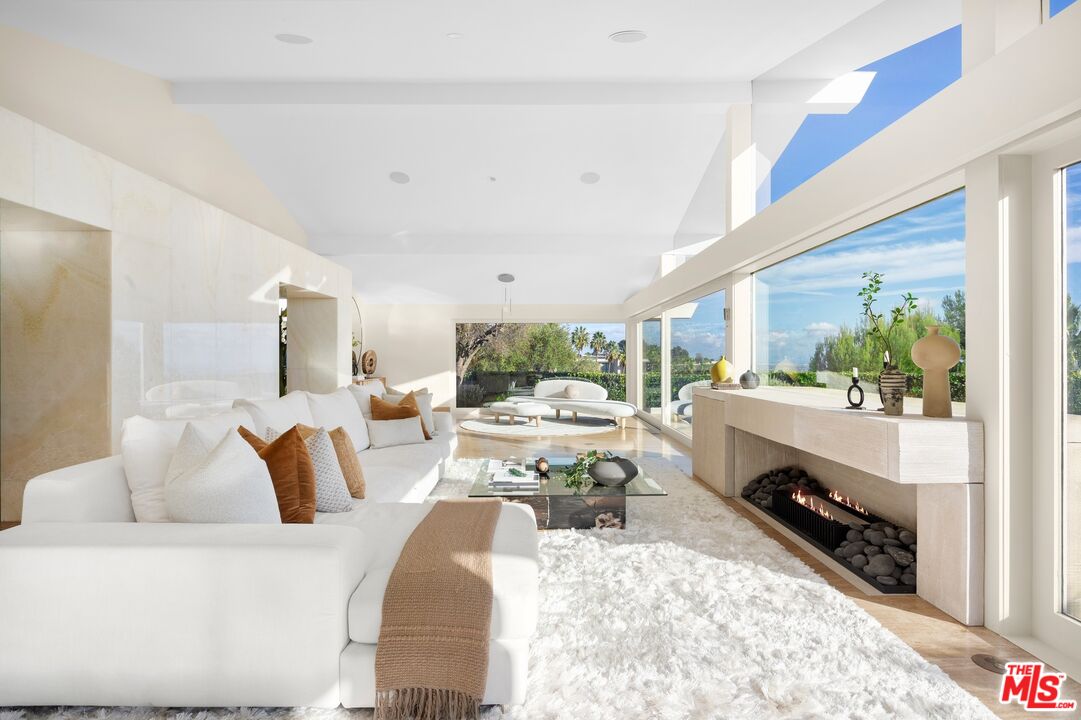 11496 Orum Road Los Angeles, CA 90049 - Photo 9 of 30 a living room with furniture fireplace and window