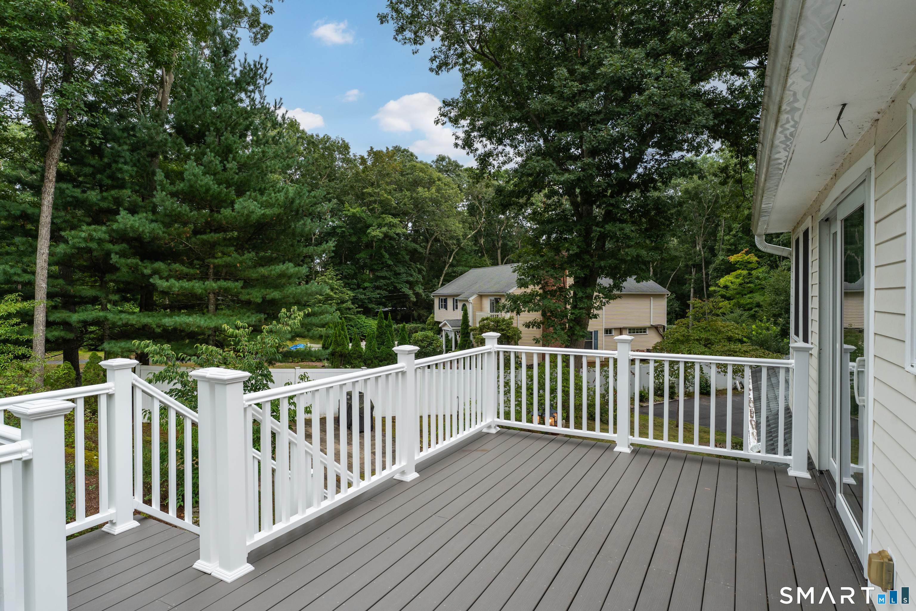 38 Church Lane Madison, CT 06443 - Photo 32 of 40 Brand new Trex deck with vinyl railings for easy maintenance.
