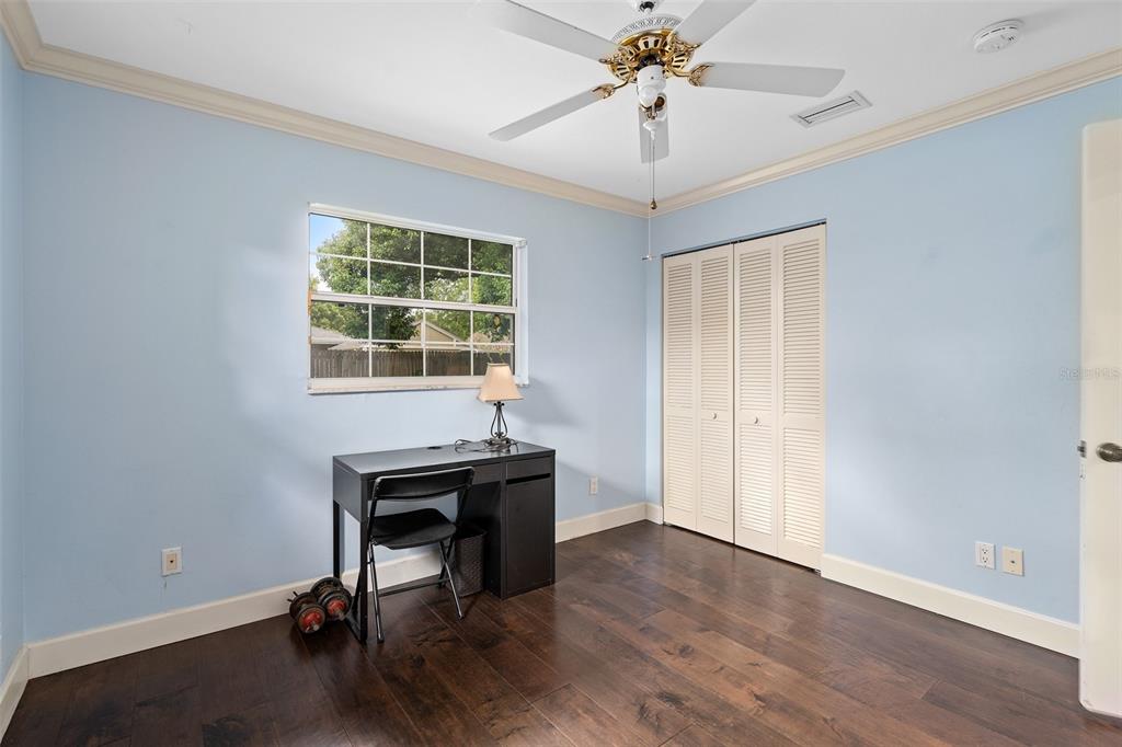 744 Cornwall Road Winter Park, FL 32792 - Photo 13 of 57 a view of a workspace with furniture and a window
