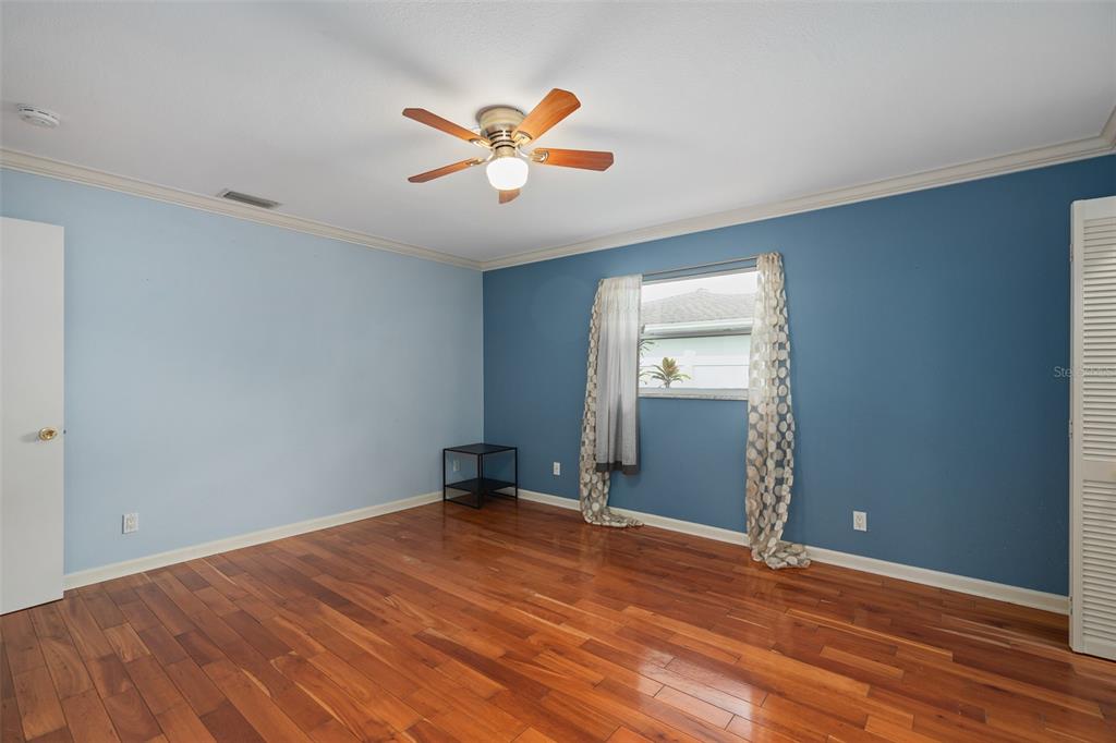 744 Cornwall Road Winter Park, FL 32792 - Photo 15 of 57 a view of empty room with wooden floor and fan