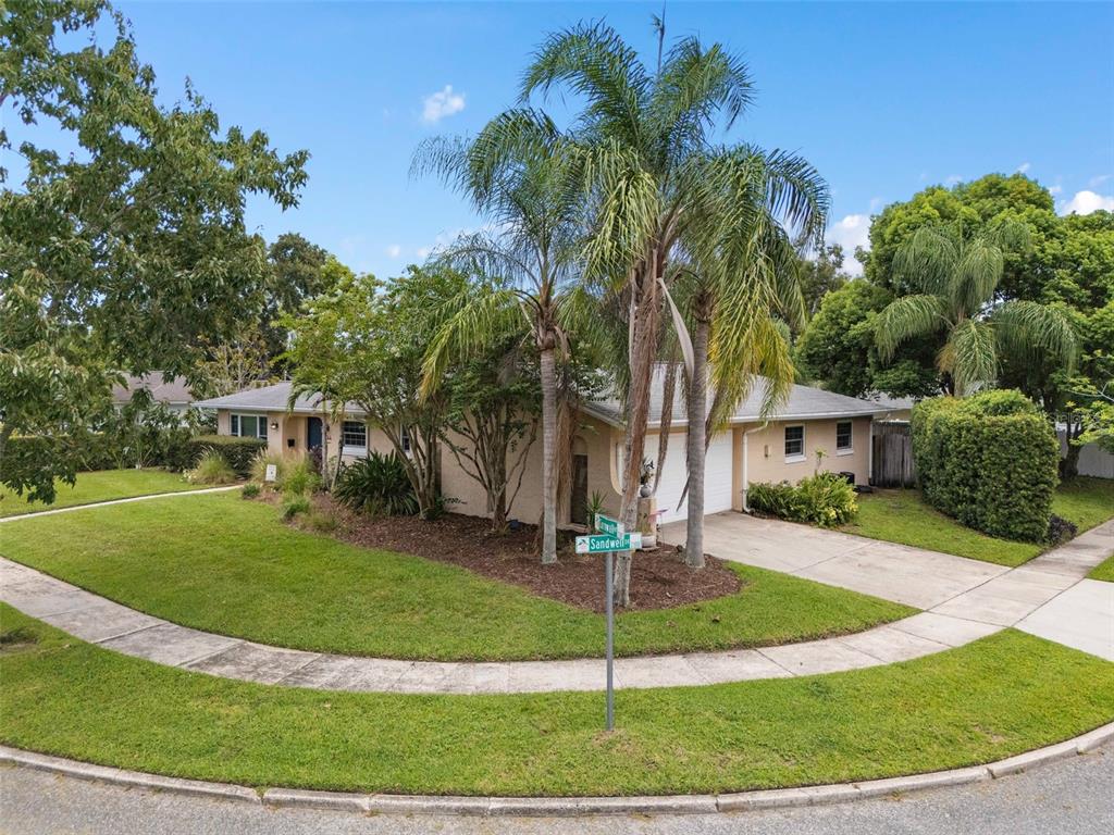 744 Cornwall Road Winter Park, FL 32792 - Photo 26 of 57 a front view of a house with a yard