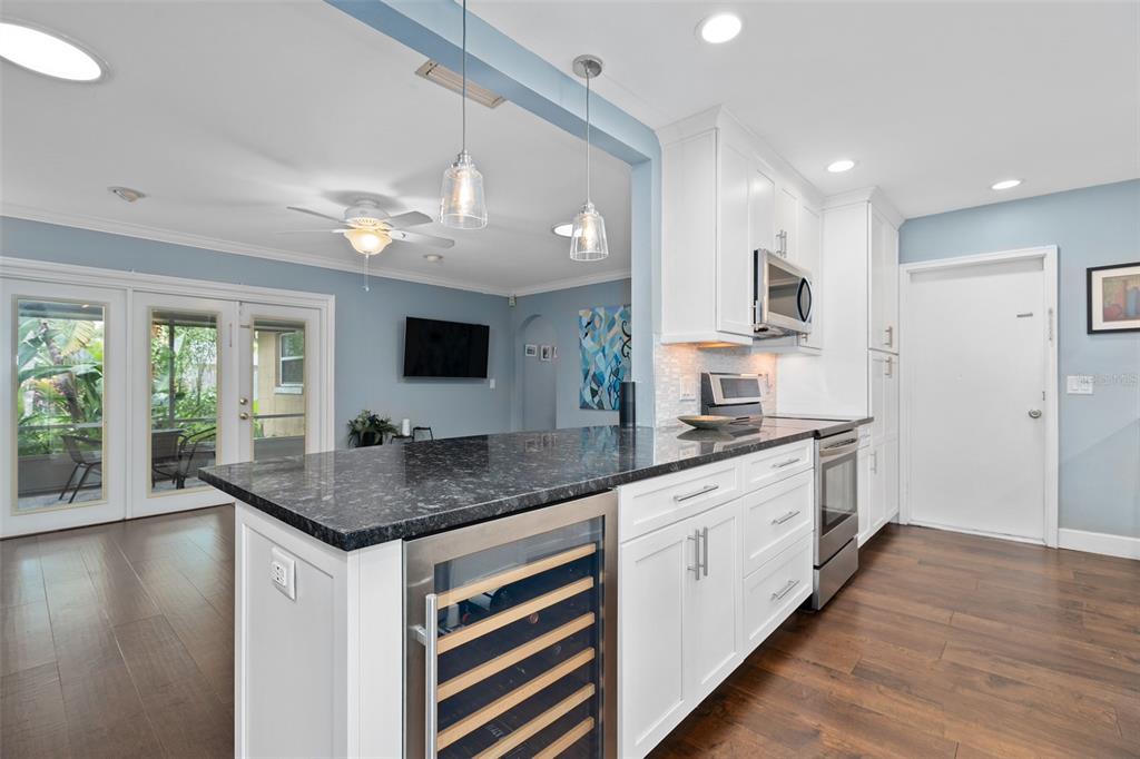 744 Cornwall Road Winter Park, FL 32792 - Photo 3 of 33 a kitchen with stainless steel appliances granite countertop a sink stove and refrigerator