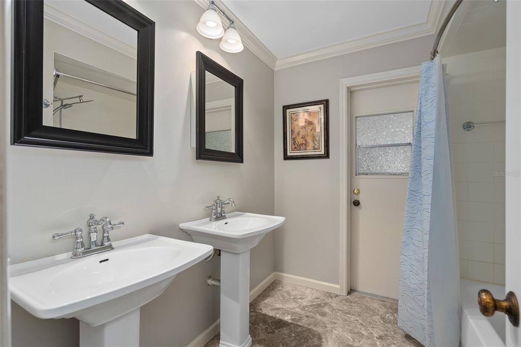 744 Cornwall Road Winter Park, FL 32792 - Photo 5 of 57 a bathroom with a sink and a mirror