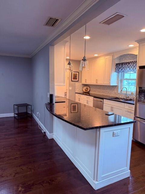744 Cornwall Road Winter Park, FL 32792 - Photo 54 of 57 a large kitchen with kitchen island a large counter space a sink and appliances