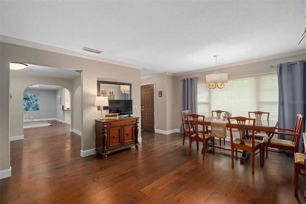 744 Cornwall Road Winter Park, FL 32792 - Photo 8 of 33 a view of a dining room with furniture window and wooden floor