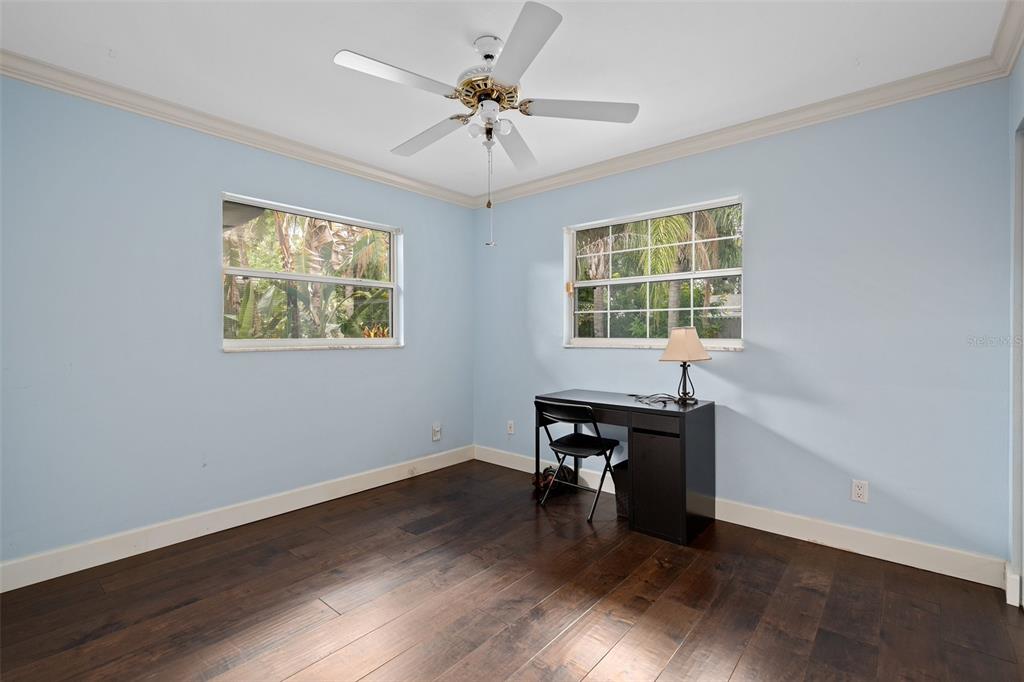744 Cornwall Road Winter Park, FL 32792 - Photo 10 of 33 a view of a workspace with wooden floor and a window