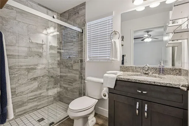 a bedroom with a bed and a mirror