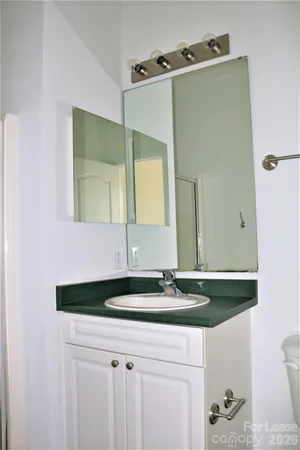 a bathroom with a glass shower door