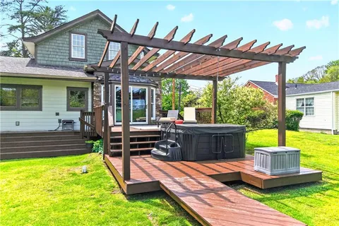 a view of a house with porch and furniture