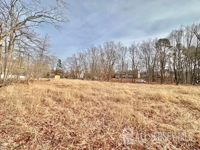a view of yard covered with snow in front of house