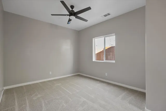 a bathroom with a toilet sink vanity and mirror