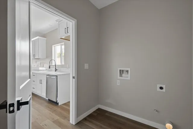 a view of a house with a wooden fence