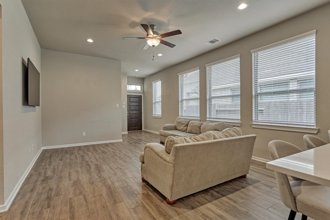 10545 Wild Chives Conroe, TX 77385 - Photo 12 of 34 a living room with furniture and a large window