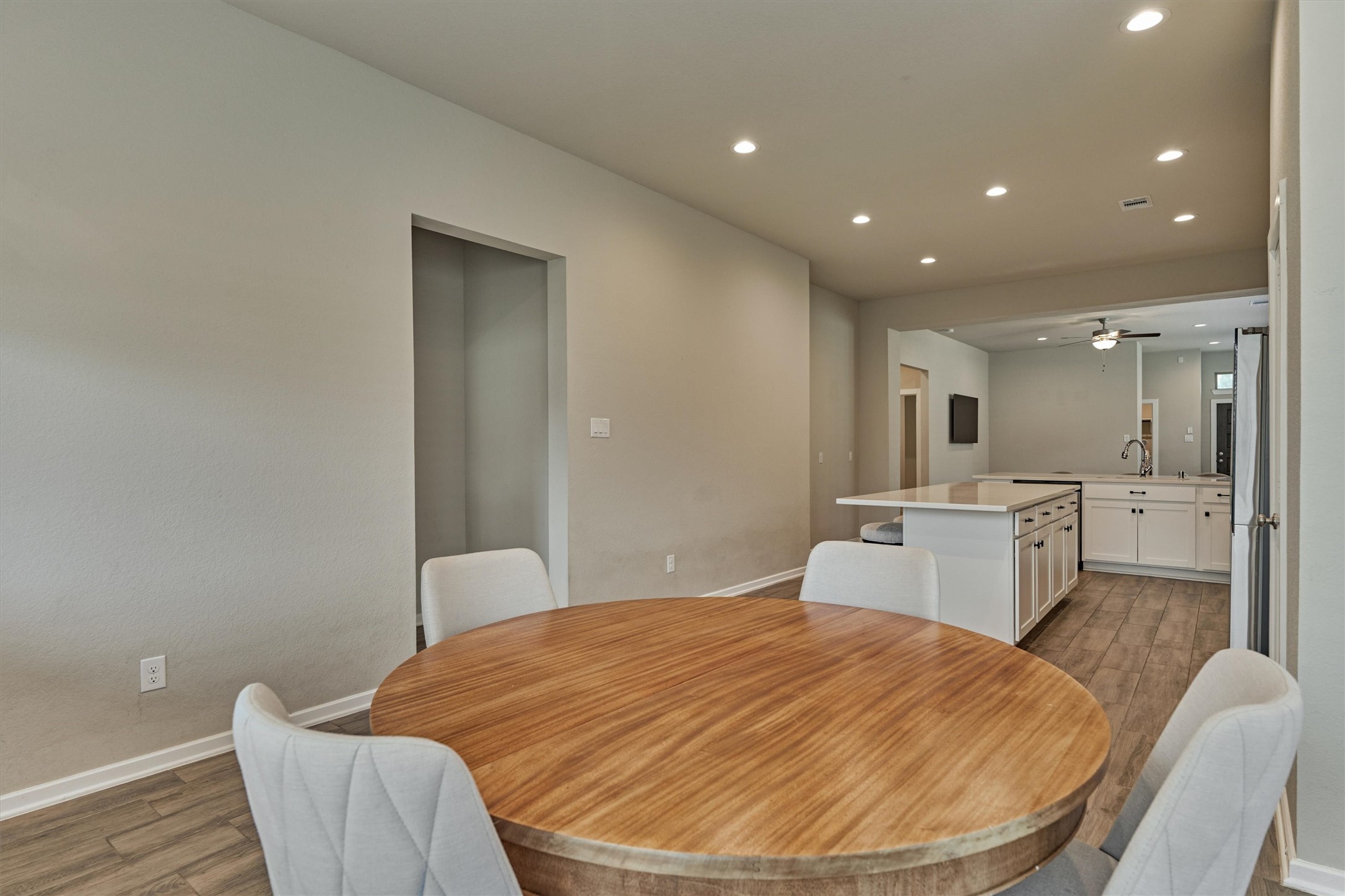 10545 Wild Chives Conroe, TX 77385 - Photo 22 of 34 a room with a bed and a view of kitchen