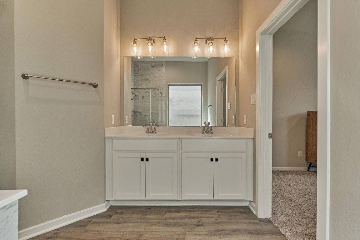 10545 Wild Chives Conroe, TX 77385 - Photo 25 of 34 a bathroom with a sink and a mirror