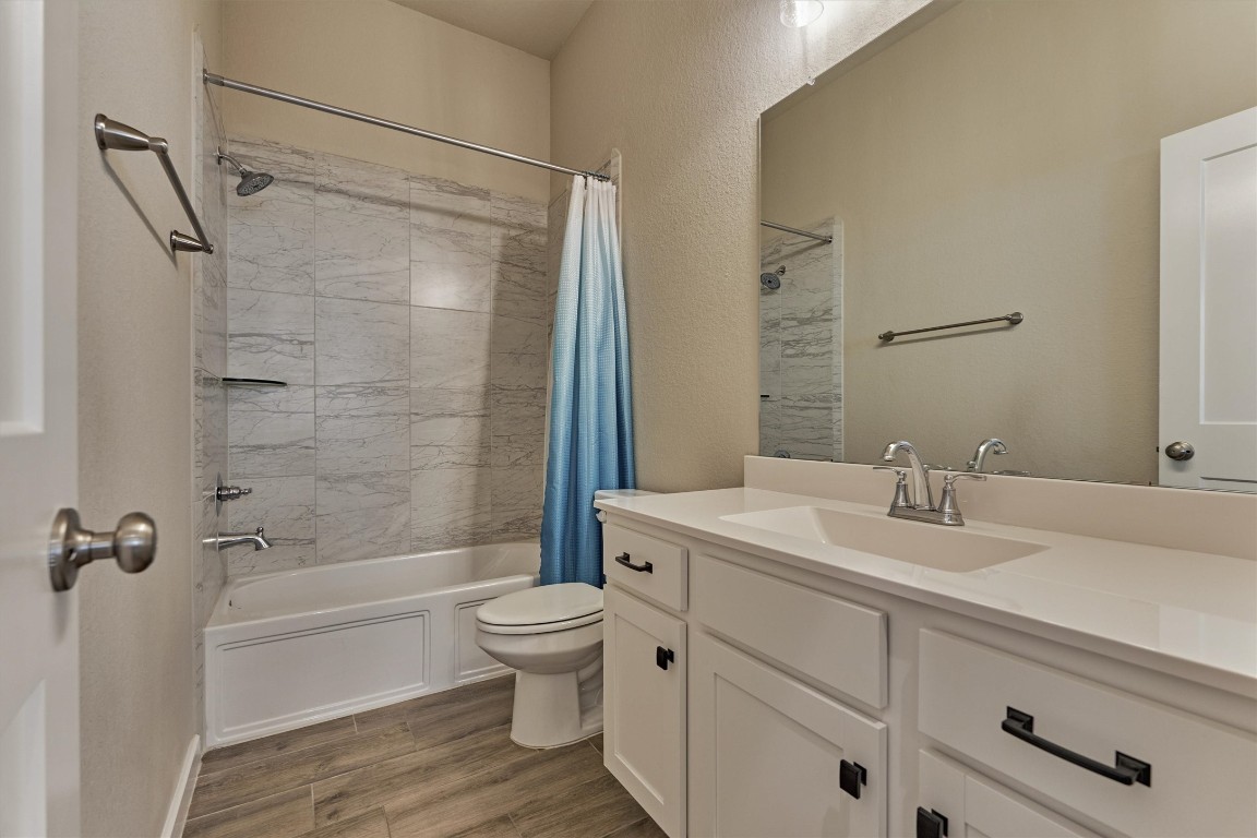 10545 Wild Chives Conroe, TX 77385 - Photo 28 of 34 a bathroom with a sink toilet and shower