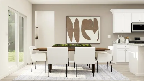 a view of a dining room with furniture window and wooden floor