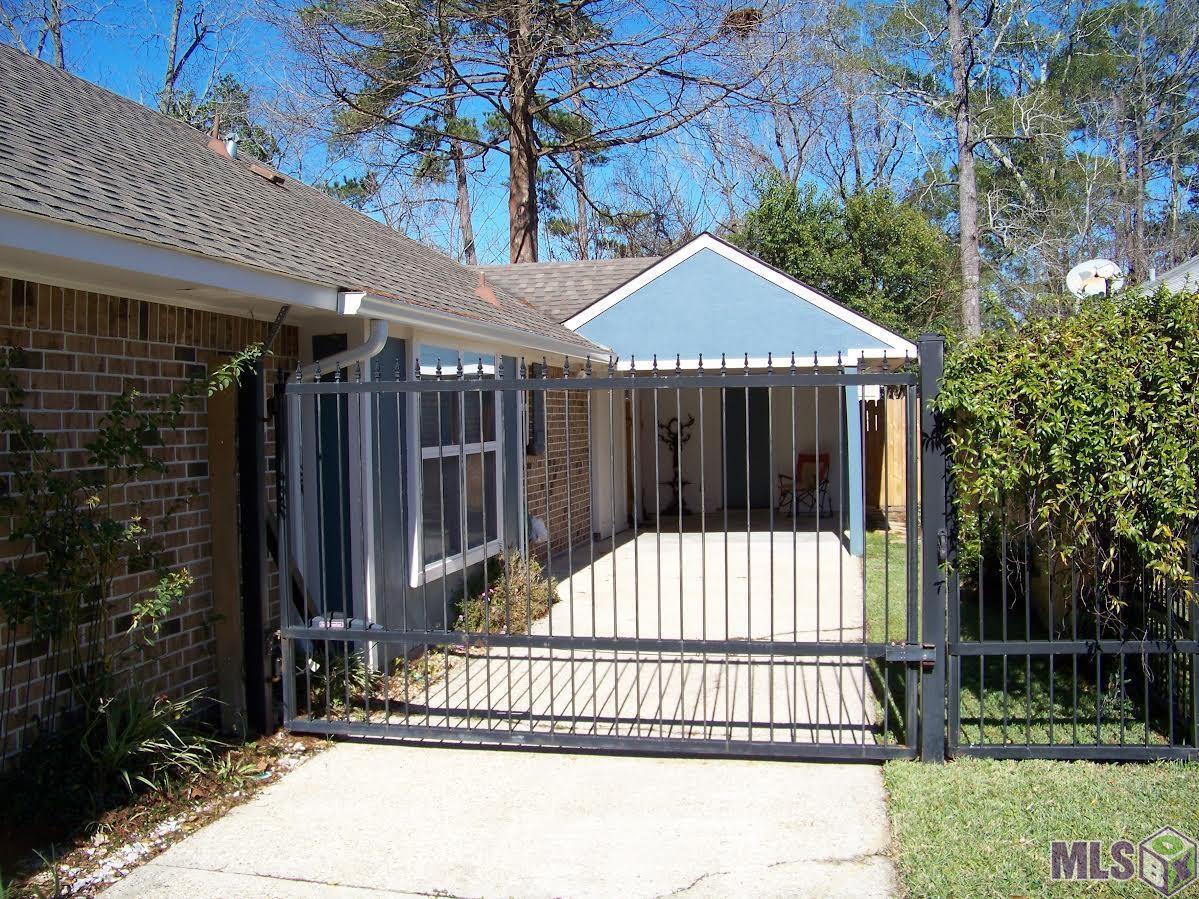 8525 Barnett Drive Baton Rouge, LA 70809 - Photo 3 of 29 Carport with Electric Gate