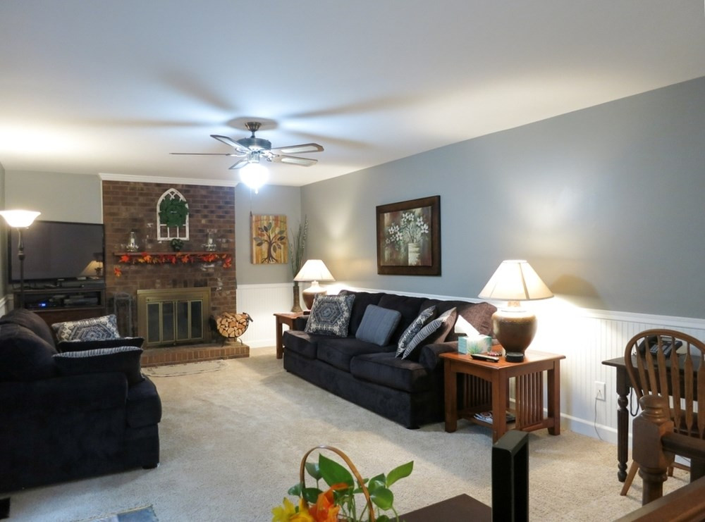 4516 Wingate Drive Raleigh, NC 27609 - Photo 11 of 25 The spacious Living Rm features a brick wood burning FP, neutral carpet, CF, bead board wainscot & french doors to the Deck, great for grilling & entertaining. Living Room