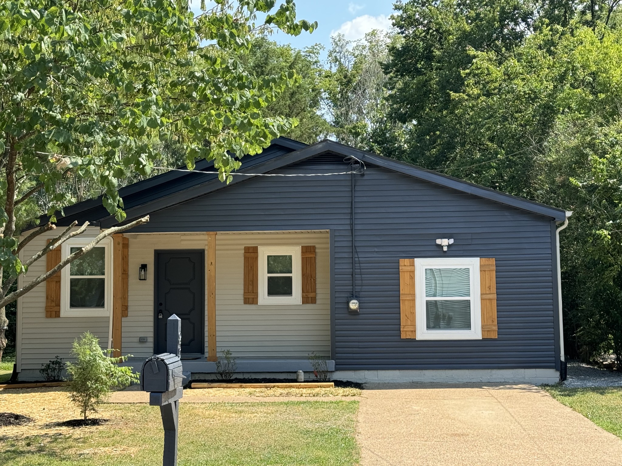 256 Warrior Road Madison, TN 37115 - Photo 1 of 23 a front view of a house with garden