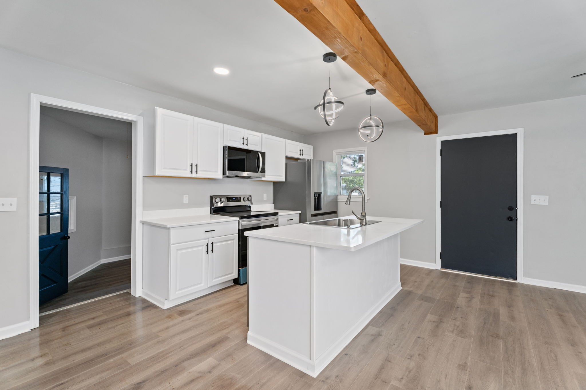 256 Warrior Road Madison, TN 37115 - Photo 5 of 23 a kitchen with a sink stove and refrigerator