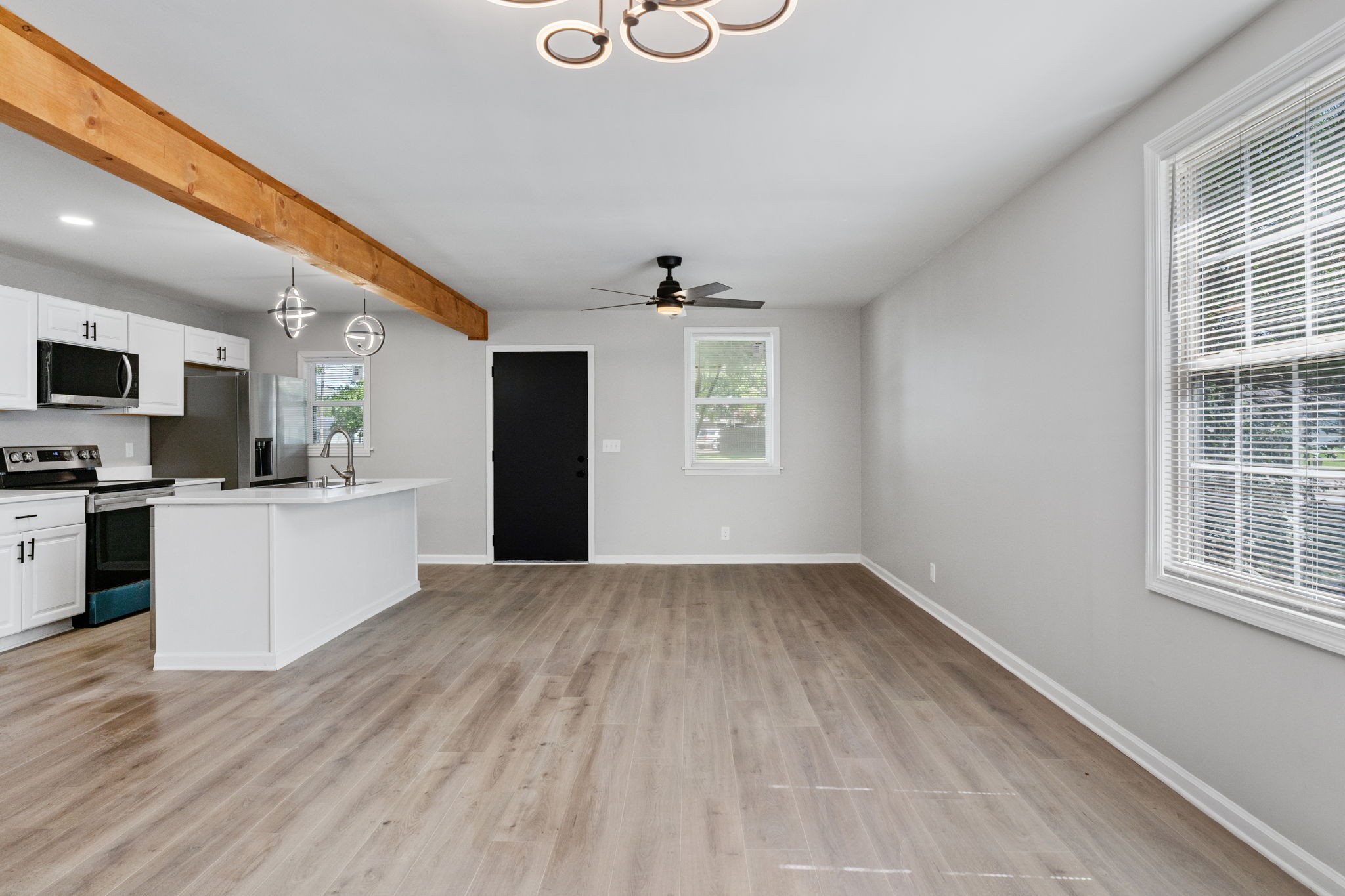 256 Warrior Road Madison, TN 37115 - Photo 8 of 23 a view of a kitchen with microwave and windows