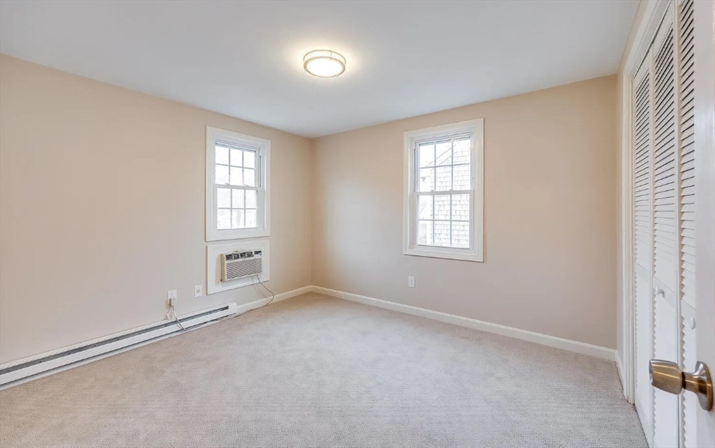 135 West Main Street, Unit 11 Barnstable, MA 02601 - Photo 7 of 11 an empty room with windows