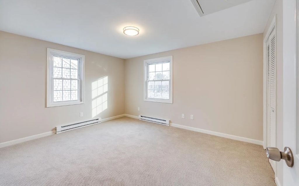 135 West Main Street, Unit 11 Barnstable, MA 02601 - Photo 8 of 11 an empty room with windows