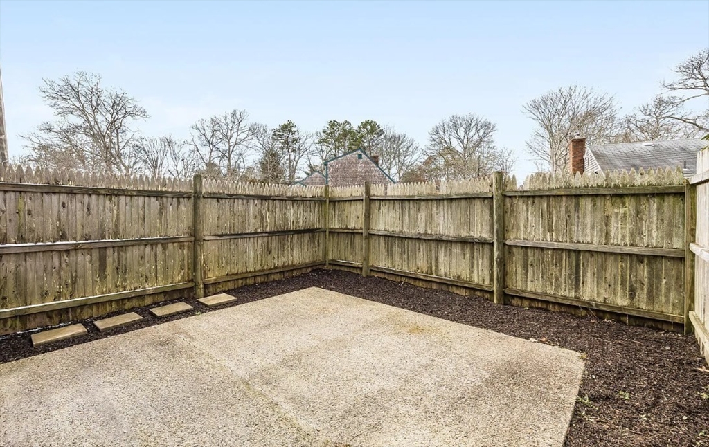 135 West Main Street, Unit 11 Barnstable, MA 02601 - Photo 10 of 11 a view of a balcony with wooden floor