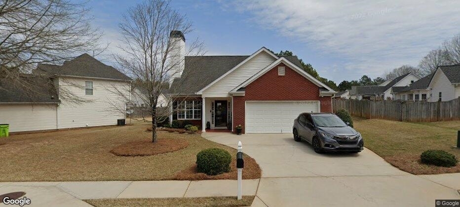 152 Riva Ridge Lane Newnan, GA 30263 - Photo 1 of 1 a front view of a house with cars parked