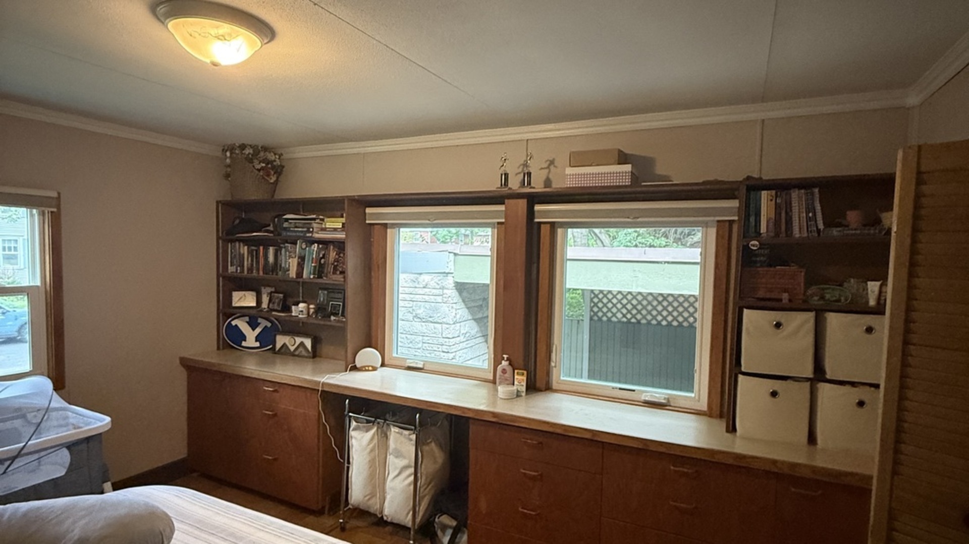 707 West Iowa Street Urbana, IL 61801 - Photo 11 of 25 a bathroom with a sink a mirror and a window