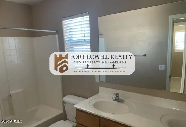 a bathroom with a sink a mirror and a shower