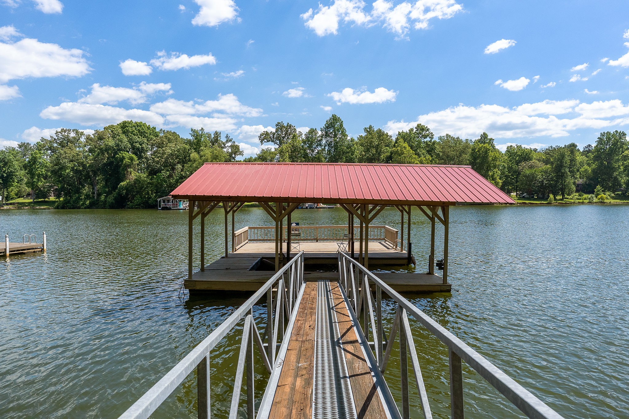 142 Rayahs Way Quebeck, TN 38579 - Photo 47 of 73 a view of a lake with a deck