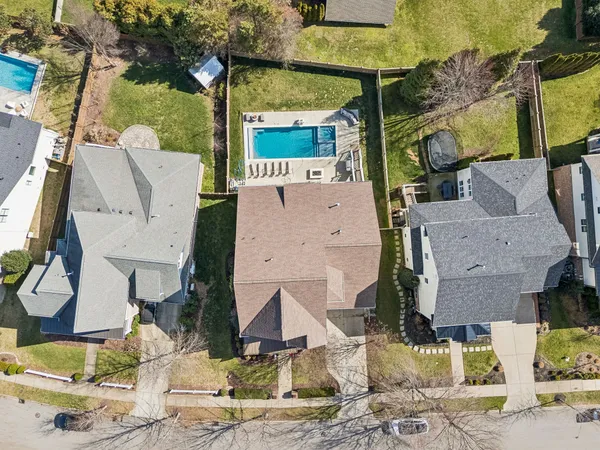 a aerial view of a house with a yard