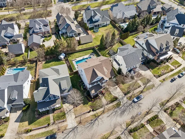an aerial view of residential houses with outdoor space