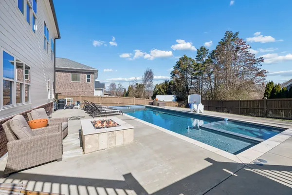 a outdoor space with seating area and trees