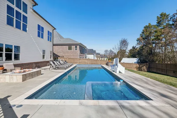 a view of a house with sink and outdoor kitchen