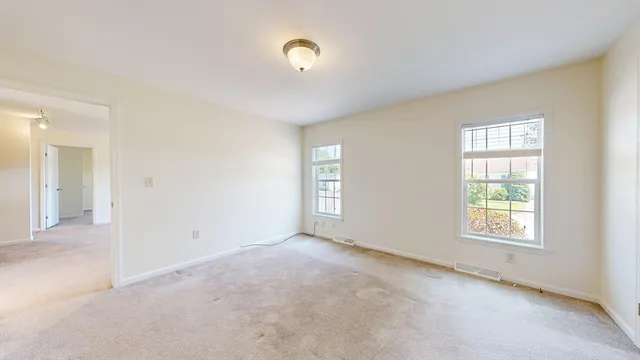an empty room with windows