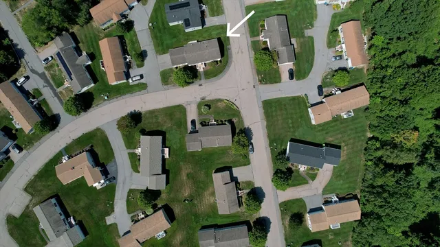 an aerial view of houses with outdoor space
