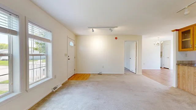 a view of an empty room with a window