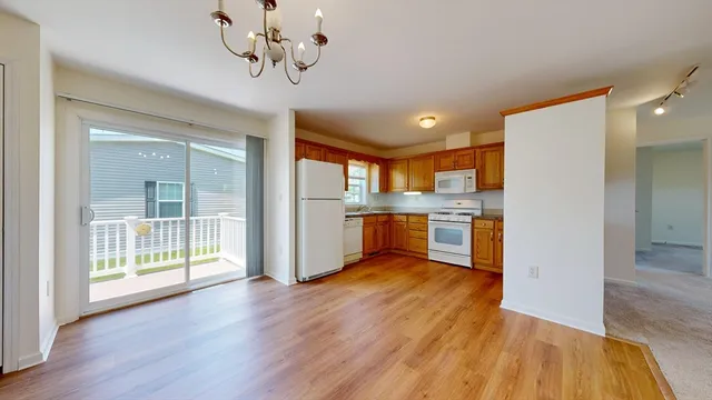 a view of kitchen with wooden floor