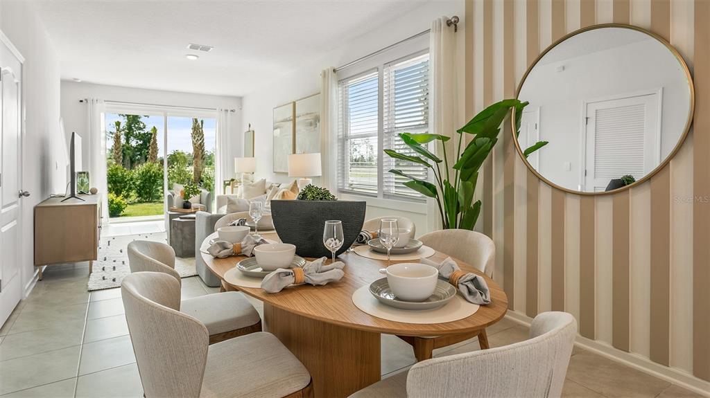 a view of a dining room with furniture window and wooden floor