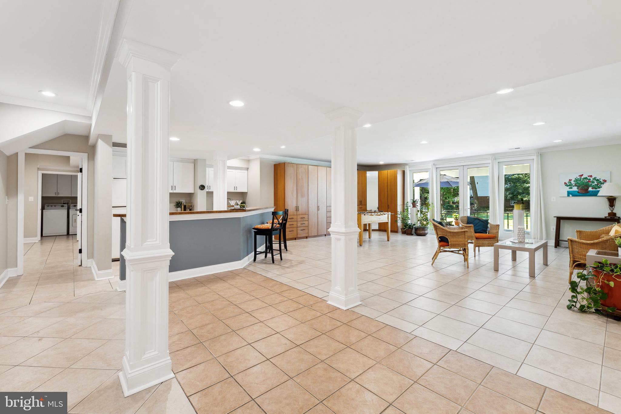 8810 Brickyard Road Potomac, MD 20854 - Photo 102 of 136 Lower level rec area w/ full wet bar & walkout