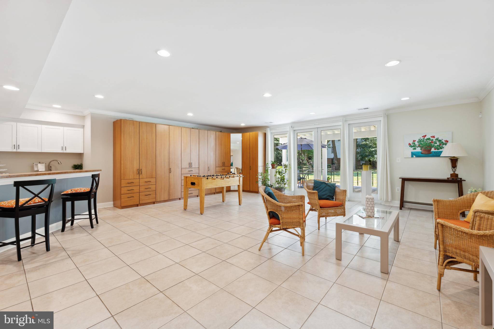 8810 Brickyard Road Potomac, MD 20854 - Photo 105 of 136 Lower level rec area w/ full wet bar & walkout