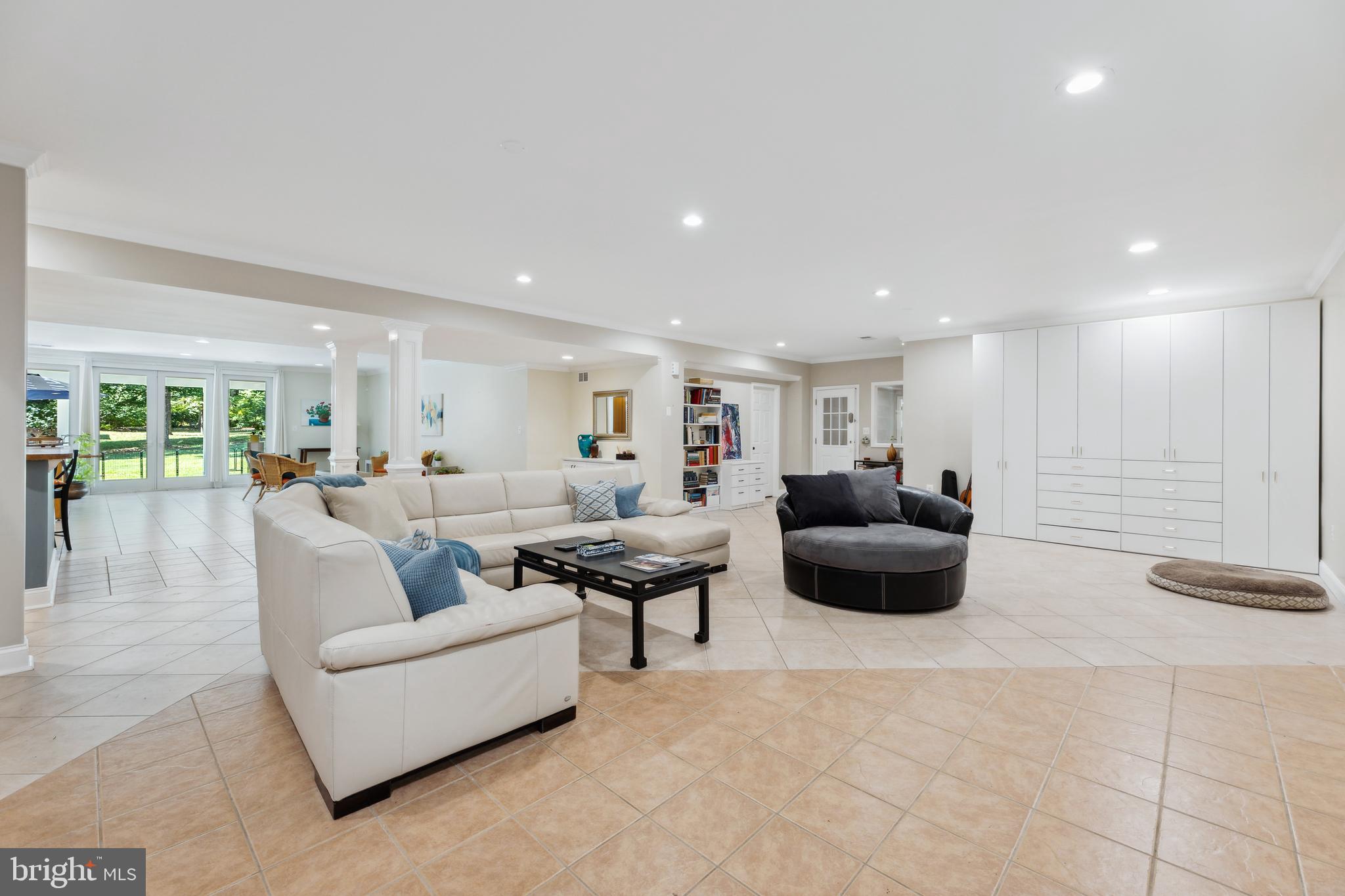 8810 Brickyard Road Potomac, MD 20854 - Photo 99 of 136 Lower level rec area w/ full wet bar & walkout