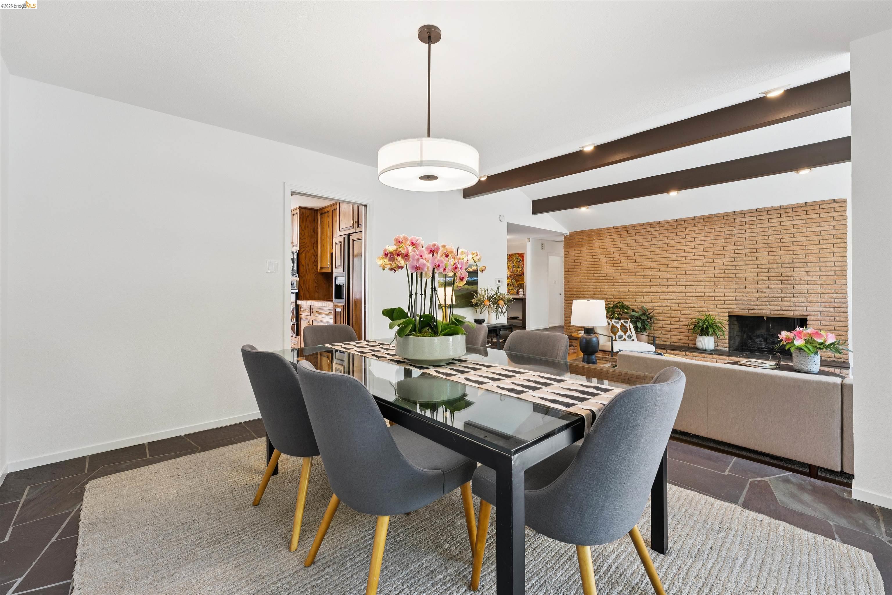 7 Jo Lin Court El Sobrante, CA 94803 - Photo 39 of 99 Open-concept dining area featuring dark slate flooring, a modern drum pendant light, and recessed lighting