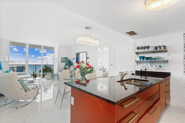 a kitchen that has a sink and cabinets