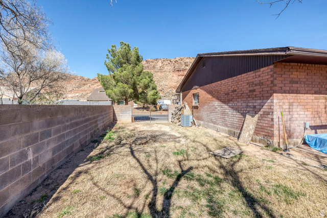 3334 Ute Road St. George, UT 84790 - Photo 36 of 40 Fenced backyard with a mountain view
