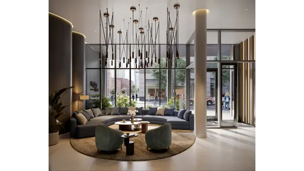 a living room with furniture and large windows