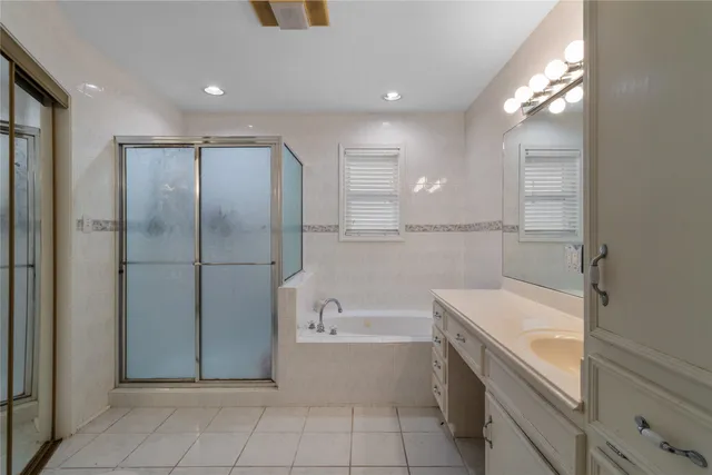 a bathroom with a bathtub and a sink